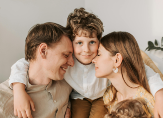 Mental Health Resilience for Parents Parents being held by their son.
