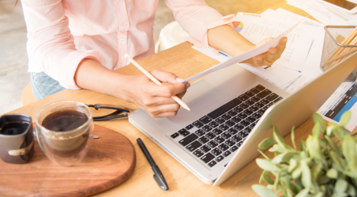 A small business owner on a computer at her desk.