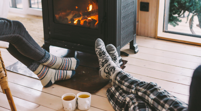 Resting by the fireplace.