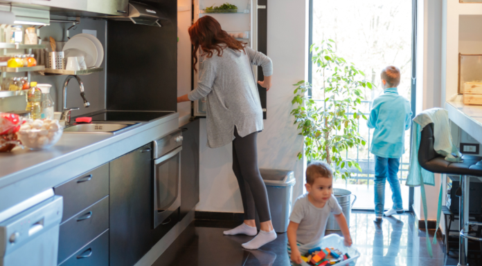 A busy family in the kitchen.
