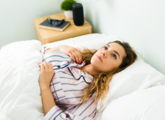 A woman laying in bed.