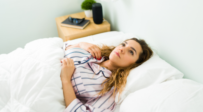 A woman laying in bed.