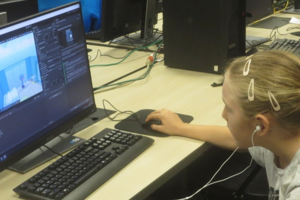 A girl on a computer at Computer Camp.