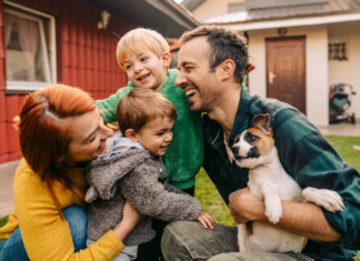 A family with a puppy.