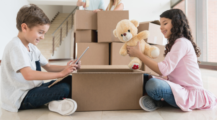 The Home That Raised Me and My Babies Kids packing boxes to move.