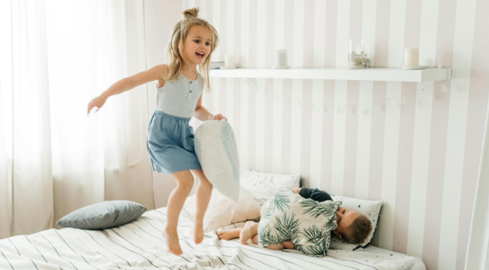 Jumping on the bed.