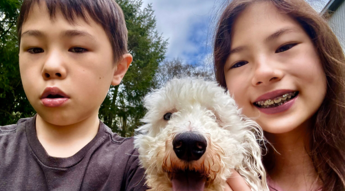 Kids with a dog.