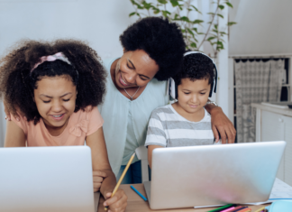 Teacher Appreciation Week: A Love Letter to the Woman Who Does it All A mom homeschooling her children while they are on computers.