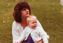 A mom holding her daughter.