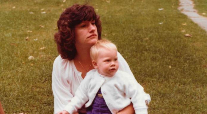 A mom holding her daughter.