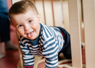 A boy sticking out his tongue.