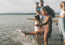 I Just Want to Live on Vacation A family splashing in the water.