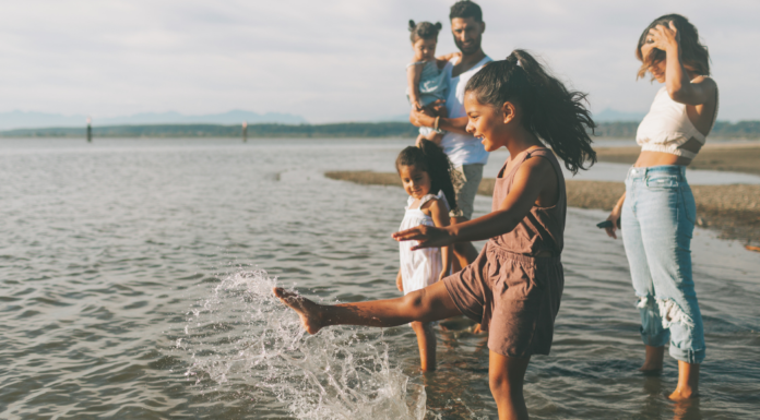 A family splashing in the water.