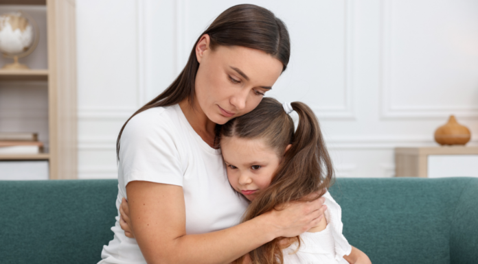 A mom and daughter embracing.