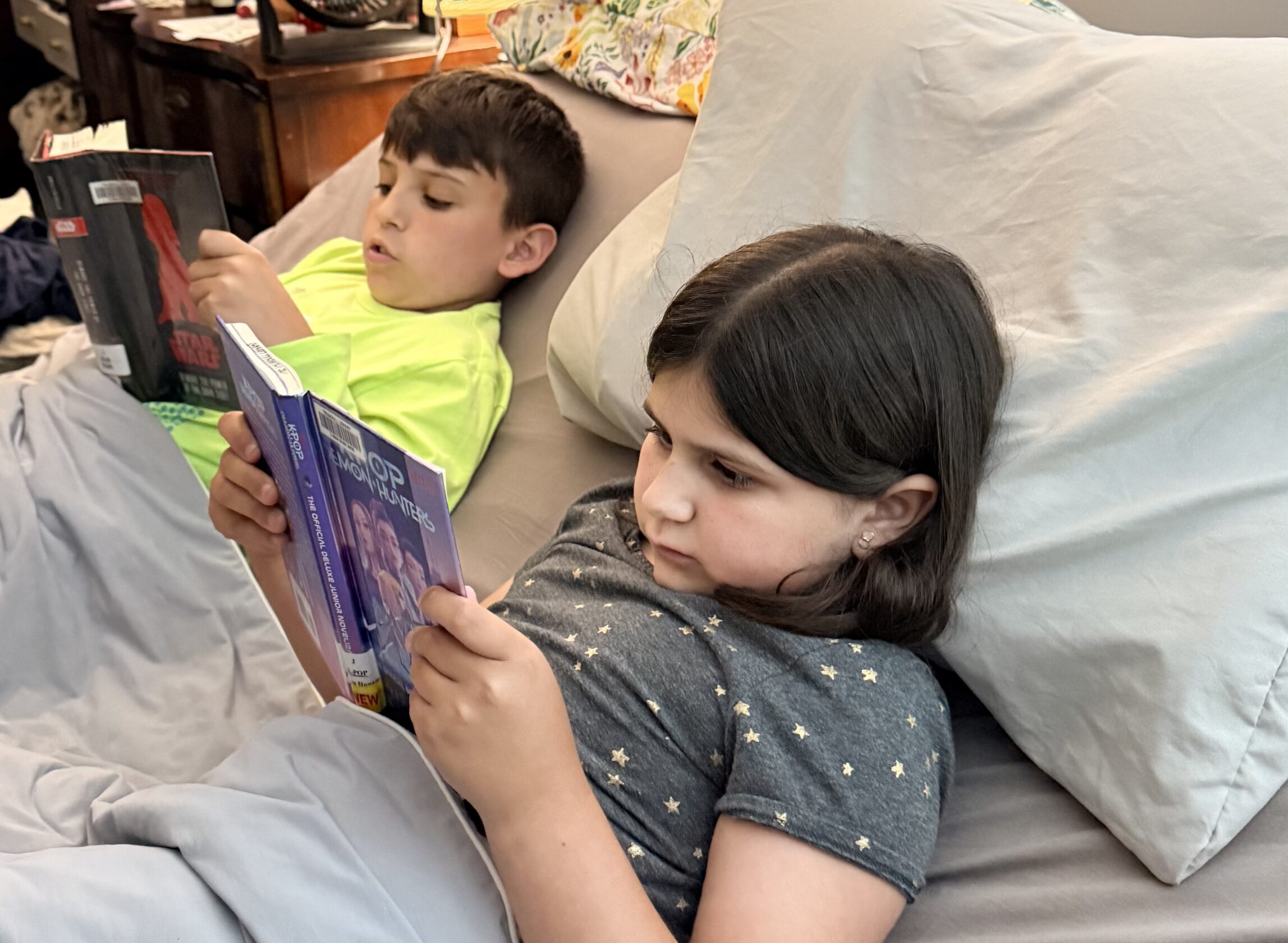 Kids reading in bed.