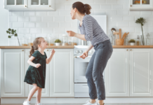 Motherhood Is a Country Song A mom dancing to country music with her daughter.