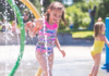 Girls playing in a splash pad.