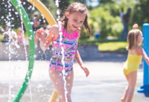 Girls playing in a splash pad.