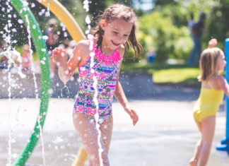 Girls playing in a splash pad.