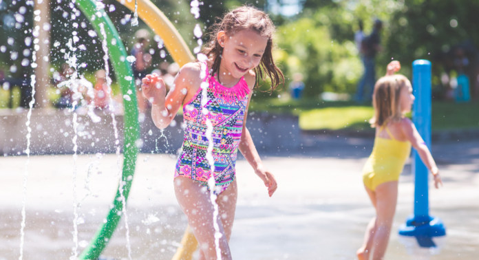 Girls playing in a splash pad.