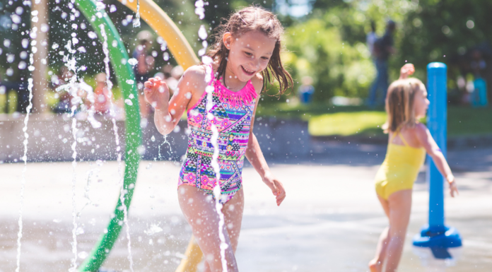 Girls playing in a splash pad.