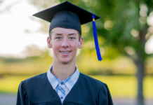 A boy in his graduation cap and gown.