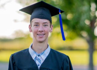 Graduation, How Are We Here? A boy in his graduation cap and gown.
