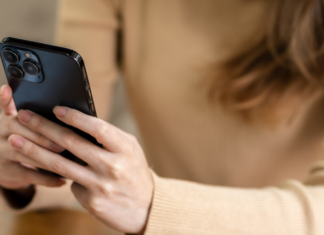 A woman texting.