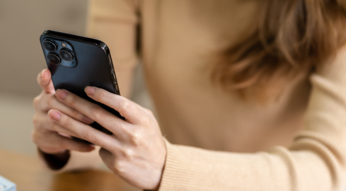 A woman texting.