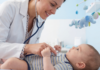 A pediatrician checking a baby.