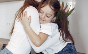 A Wink From the Universe A daughter hugging her mom.