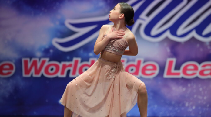 Proof of Life (Included with Registration) A girl at a dance competition.