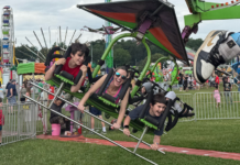 Don’t Forget the Fun A mom on a ride with her boys.
