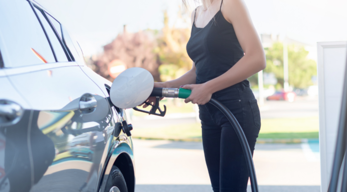 One Tank Trips: Family Adventures Are Just a Short Drive Away A woman pumping gas.
