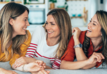 Female friends laughing together.
